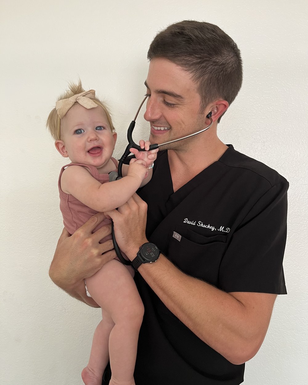 David Shockey, M.D., with a young patient at Brown Road Family Medicine.